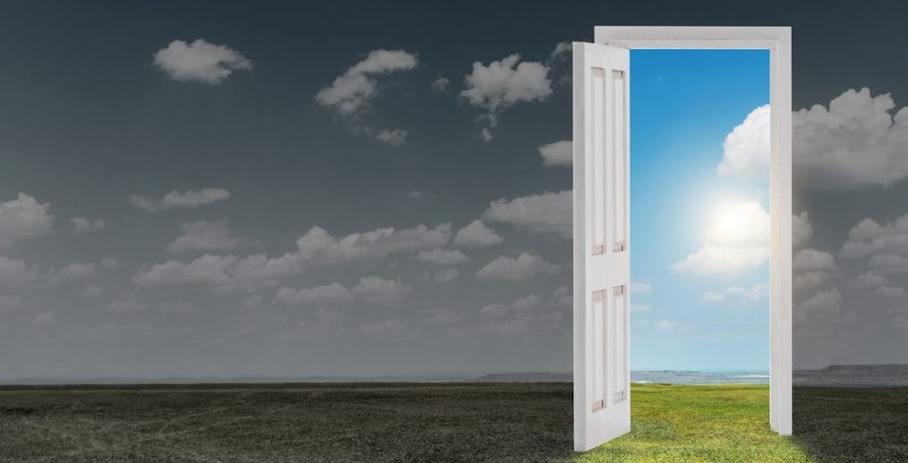 A field with a door and the open door shows a bright version of the field.